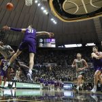 
              Purdue guard Isaiah Thompson (11) shoots over Northwestern forward Robbie Beran (31) in the second half of an NCAA college basketball game in West Lafayette, Ind., Sunday, Jan. 23, 2022. Purdue won 80-60. (AP Photo/AJ Mast)
            