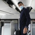 
              Novak Djokovic prepares to take his seat on a plane to Belgrade, in Dubai, United Arab Emirates, Monday, Jan. 17, 2022. Djokovic was deported from Australia on Sunday after losing a bid to stay in the country to defend his Australian Open title despite not being vaccinated against COVID-19.(AP Photo/Darko Bandic)
            