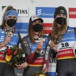 
              From left, runner-up Natalie Geisenberger, winner Julia Taubitz, both from Germany and third-placed Madeleine Egle from Austria stand on the podium after the women's single-seater competition of the Luge World Cup in Winterberg, Germany, Sunday, Jan. 2, 2022. (Friso Gentsch/dpa via AP)
            