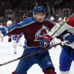 
              Colorado Avalanche defenseman Cale Makar (8) and Montreal Canadiens center Laurent Dauphin (45) tangle along the boards during the first period of an NHL hockey game Saturday, Jan. 22, 2022, in Denver. (AP Photo/Jack Dempsey)
            