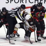 
              Ottawa Senators' Artem Zub (2) and Senators' Nick Paul (21) battle for the puck with Anaheim Ducks' Max Comtois (44) during the first period of an NHL hockey game in Ottawa, Saturday, Jan. 29, 2022. (Fred Chartrand/The Canadian Press via AP)
            