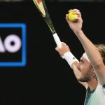 
              Stefanos Tsitsipas of Greece celebrates after defeating Taylor Fritz of the U.S. in their fourth round match at the Australian Open tennis championships in Melbourne, Australia, early Tuesday, Jan. 25, 2022. (AP Photo/Simon Baker)
            