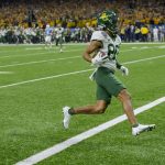 
              Baylor wide receiver Monaray Baldwin scores a touchdown against Mississippi during the second half of the Sugar Bowl NCAA college football game in New Orleans, Saturday, Jan. 1, 2022. (AP Photo/Matthew Hinton)
            