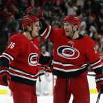 
              Carolina Hurricanes' Brady Skjei (76) is congratulated on his goal by teammate Brett Pesce (22) during the second period of an NHL hockey game against the Florida Panthers in Raleigh, N.C., Saturday, Jan. 8, 2022. (AP Photo/Karl B DeBlaker)
            