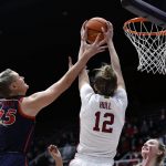 
              Arizona forward Cate Reese (25) battles for the ball against Stanford guard Lexie Hull (12) during the second half of an NCAA college basketball game Sunday, Jan. 30, 2022, in Stanford, Calif. (AP Photo/Josie Lepe)
            