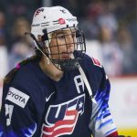 
              FILE - United States' Hilary Knight looks on before a women's hockey game against the Canada, Oct. 22, 2021, in Allentown, Pa. Cammi Granato had never forgotten the young girl she lent her stick and gloves to during one of the former U.S. Olympian’s first hockey camps in Chicago in the late 1990s. It was not until years later when Granato discovered that girl just happened to be Knight. (AP Photo/Chris Szagola, File)
            