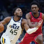 
              Utah Jazz guard Donovan Mitchell (45) drives to the basket against New Orleans Pelicans forward Herbert Jones in the second half of an NBA basketball game in New Orleans, Monday, Jan. 3, 2022. The Jazz won 115-104. (AP Photo/Gerald Herbert)
            