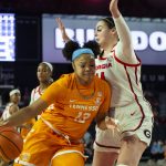 
              Tennessee Lady Vols forward Keyen Green (13) dribbles past Georgia Lady Bulldogs center Jenna Staiti (14) during the first half of an NCAA college basketball game Sunday, Jan. 23, 2022, in Athens, Ga. (AP Photo/Hakim Wright Sr.)
            
