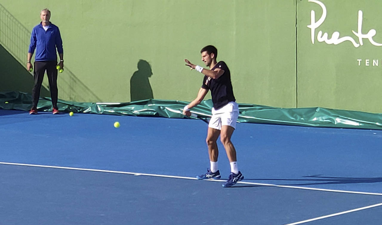 Serbia's Novak Djokovic trains on a tennis court in Marbella, Spain, on Jan. 2, 2022. Djokovic held...