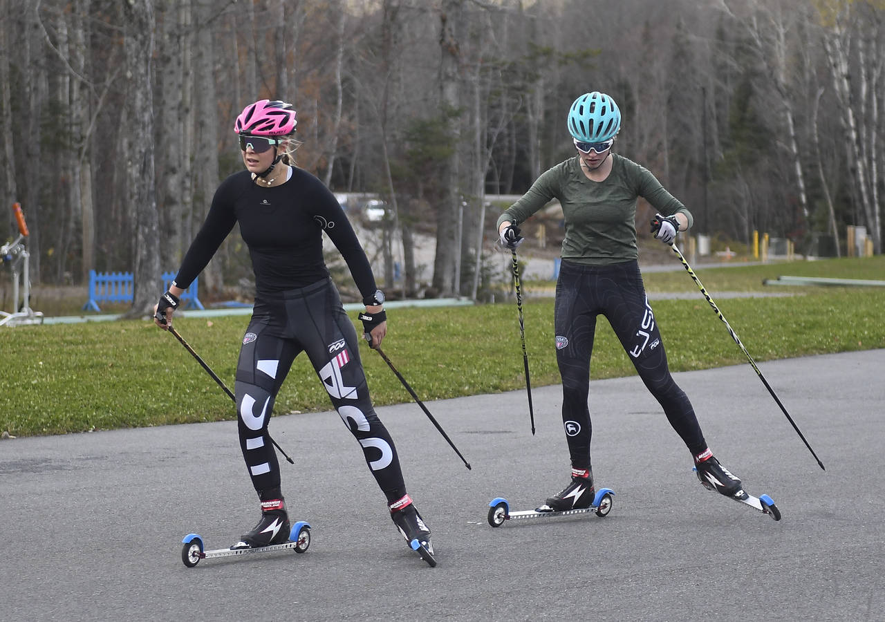 Annika Malacinski, left, and Alexa Brabec take part in a roller ski training session for the 2022 U...