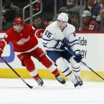 
              Detroit Red Wings center Pius Suter (24) pursues Toronto Maple Leafs right wing Ilya Mikheyev (65) during the first period of an NHL hockey game Saturday, Jan. 29, 2022, in Detroit. (AP Photo/Duane Burleson)
            