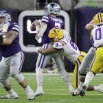
              Kansas State quarterback Skylar Thompson (7) is sacked for a loss by LSU defensive end BJ Ojulari (8) during the first half of the Texas Bowl NCAA college football game Tuesday, Jan. 4, 2022, in Houston. (AP Photo/Michael Wyke)
            
