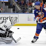 
              Los Angeles Kings goaltender Cal Petersen makes a save in front of New York Islanders left wing Anthony Beauvillier in the second period of an NHL hockey game Thursday, Jan. 27, 2022, in Elmont, N.Y. (AP Photo/Adam Hunger)
            