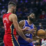 
              Philadelphia 76ers' Joel Embiid, right, tries to make his move against New Orleans Pelicans' Willy Hernangomez, left, during the first half of an NBA basketball game, Tuesday, Jan. 25, 2022, in Philadelphia. (AP Photo/Chris Szagola)
            