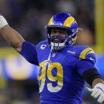
              Los Angeles Rams defensive end Aaron Donald (99) celebrates during the first half of an NFL wild-card playoff football game against the Arizona Cardinals in Inglewood, Calif., Monday, Jan. 17, 2022. (AP Photo/Mark J. Terrill)
            