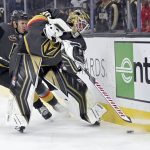 
              Vegas Golden Knights goaltender Robin Lehner (90) covers the puck with right wing Evgenii Dadonov (63) against the Pittsburgh Penguins during the first period of an NHL hockey game Monday, Jan. 17, 2022, in Las Vegas. (AP Photo/David Becker)
            