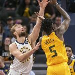 
              Indiana Pacers forward Domantas Sabonis (11) attempts to block a shot by Utah Jazz forward Norvel Pelle (5) during the first half of an NBA basketball game in Indianapolis, Saturday, Jan. 8, 2022. (AP Photo/Doug McSchooler)
            