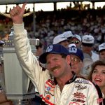 
              FILE - NASCAR driver Dale Earnhardt of Mooresville, N.C., gives a "thumbs up" to the crowd from after winning the Brickyard 500 auto race at Indianapolis Motor Speedway, Saturday, Aug. 5, 1995. As he prepares to join his late father in the NASCAR Hall of Fame, Dale Earnhardt Jr. can't help but wonder what his Dad would make of the career he's built on and off the track. (AP Photo/Tom Strattman, File)
            