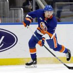 
              New York Islanders defenseman Adam Pelech (3) passes the puck during the first period of an NHL hockey game against the Philadelphia Flyers, Tuesday, Jan. 25, 2022, in Elmont, N.Y. (AP Photo/Corey Sipkin)
            