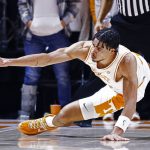 
              Tennessee forward Olivier Nkamhoua (13) dives for a loose ball during an NCAA college basketball game against South Carolina, Tuesday, Jan. 11, 2022, in Knoxville, Tenn. (AP Photo/Wade Payne)
            