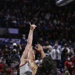 
              Gonzaga forward Drew Timme, left, shoots over Loyola Marymount forward Keli Leaupepe during the first half of an NCAA college basketball game, Thursday, Jan. 27, 2022, in Spokane, Wash. (AP Photo/Young Kwak)
            