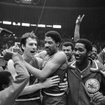 
              FILE - Philadelphia 76ers Bobby Jones, left, embraces Julius Erving after 76ers defeating the Los Angeles Lakers in four straight games to win the NBA Championship, May 31, 1983. (AP Photo, File)
            