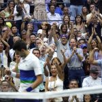 
              FILE - Tennis fans applaud Novak Djokovic, of Serbia, after he broke serve on Daniil Medvedev, of Russia, during the men's singles final of the US Open tennis championships, Sept. 12, 2021, in New York. The Australian government has denied No. 1-ranked Djokovic entry to defend his title in the year's first tennis major and canceled his visa because he failed to meet the requirements for an exemption to the country's COVID-19 vaccination rules. (AP Photo/Elise Amendola, File)
            