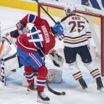 
              Montreal Canadiens' Josh Anderson scores against Edmonton Oilers goaltender Stuart Skinner as Oilers' Darnell Nurse defends during second-period NHL hockey game action in Montreal, Saturday, Jan. 29, 2022. (Graham Hughes/The Canadian Press via AP)
            