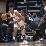 
              Sacramento Kings guard De'Aaron Fox (5) guards Houston Rockets guard Jalen Green (0) during the second half of an NBA basketball game in Sacramento, Calif., Friday, Jan. 14, 2022. The Kings won 126-114. (AP Photo/Randall Benton)
            