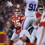 
              Kansas City Chiefs quarterback Patrick Mahomes (15) looks to pass around Buffalo Bills defensive tackle Ed Oliver (91) during the second half of an NFL divisional round playoff football game, Sunday, Jan. 23, 2022, in Kansas City, Mo. (AP Photo/Ed Zurga)
            