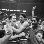 
              FILE - Philadelphia 76ers Bobby Jones, left, embraces Julius Erving after the 76ers defeated the Los Angeles Lakers in four straight games to win the NBA Championship, May 31, 1983. (AP Photo, File)
            