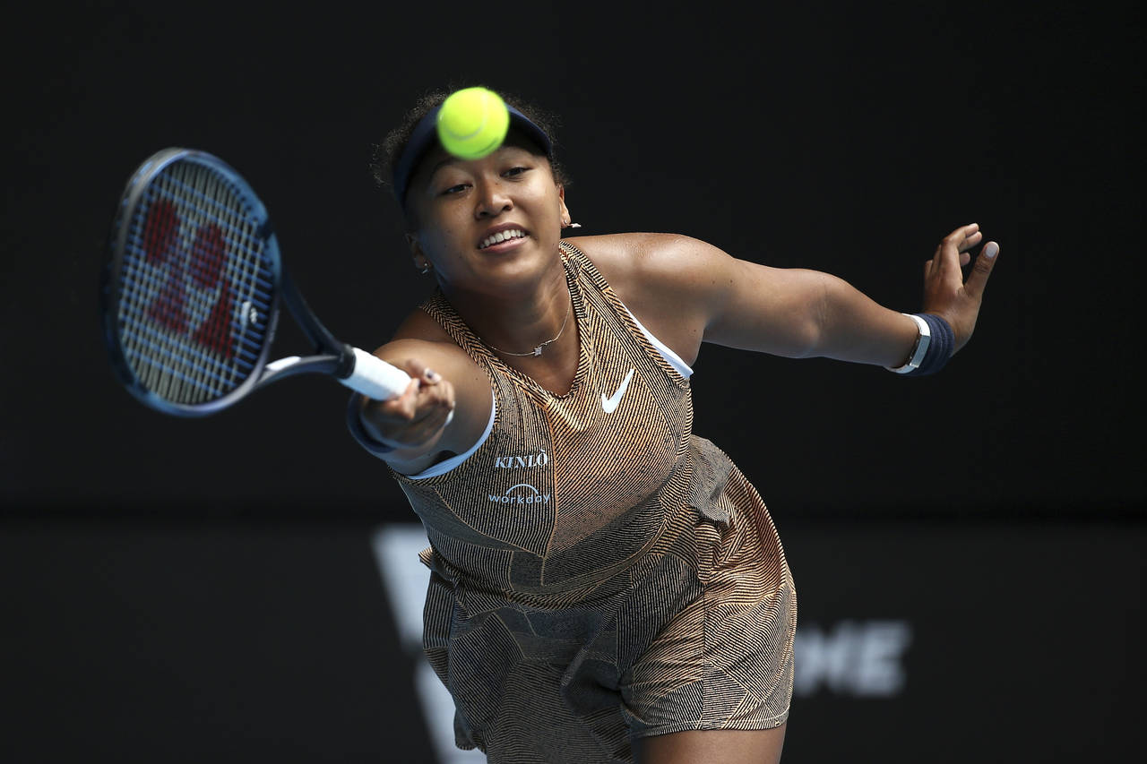 Naomi Osaka of Japan plays a forehand during her singles match against Alize Cornet of France at Su...