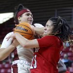 
              Boston College guard Makayla Dickens and Louisville guard Chelsie Hall (23) vie for a rebound during the second half of an NCAA college basketball game, Sunday, Jan. 16, 2022, in Boston. (AP Photo/Mary Schwalm)
            