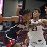 
              Arizona guard Dalen Terry (4) drives to the basket against Stanford forward Brandon Angel (23) during the first half of an NCAA college basketball game in Stanford, Calif., Thursday, Jan. 20, 2022. (AP Photo/Jeff Chiu)
            