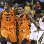 
              Oklahoma State forward Tyreek Smith, left, walks off with teammate guard Bryce Williams following their win over No. 1 Baylor in an NCAA college basketball game, Saturday, Jan. 15, 2022, in Waco, Texas. Leaving the court for Baylor is Adam Flagler, right. (Rod Aydelotte/Waco Tribune-Herald via AP)
            