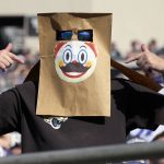 
              A fan with a bag over his head with a clown face watches the second half of an NFL football game between the Jacksonville Jaguars and the Indianapolis Colts, Sunday, Jan. 9, 2022, in Jacksonville, Fla. (AP Photo/Phelan M. Ebenhack)
            