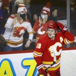 
              Calgary Flames' Matthew Tkachuk celebrates his goal against the Florida Panthers during the third period of an NHL hockey game Tuesday, Jan. 18, 2022, in Calgary, Alberta. (Jeff McIntosh/The Canadian Press via AP)
            