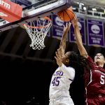 
              South Carolina forward Victaria Saxton (5) blocks a shot-attempt by LSU guard Alexis Morris (45) in the first half of an NCAA college basketball game in Baton Rouge, Thursday, Jan. 6, 2022. (AP Photo/Derick Hingle)
            