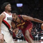 
              Portland Trail Blazers forward Trendon Watford guards Cleveland Cavaliers forward Evan Mobley during the second half of an NBA basketball game in Portland, Ore., Friday, Jan. 7, 2022. The Cavaliers won 114-101. (AP Photo/Amanda Loman)
            