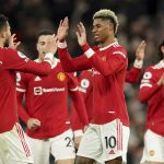 
              Manchester United's Marcus Rashford, center, celebrates with teammates after scoring his side's first goal during the English Premier League soccer match between Manchester United and West Ham at Old Trafford stadium in Manchester, England, Saturday, Jan. 22, 2022. (AP Photo/Dave Thompson)
            