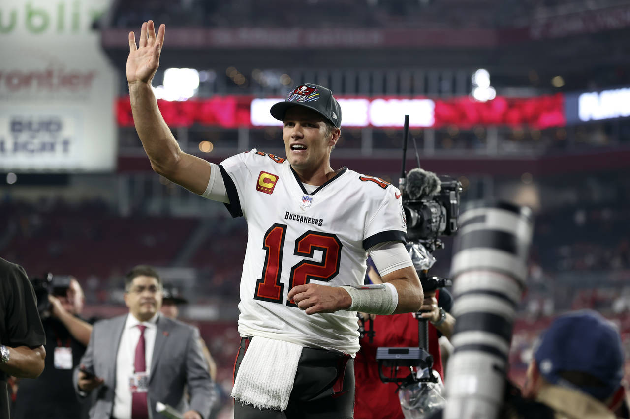 Tampa Bay Buccaneers quarterback Tom Brady (12) waves to fans after the team defeated the Carolina ...