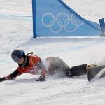 
              FILE - Ladina Jenny, of Switzerland, crashes during the women's parallel giant slalom elimination run at Phoenix Snow Park at the 2018 Winter Olympics in Pyeongchang, South Korea, Saturday, Feb. 24, 2018. Still bothering many of the riders was the way the slopestyle contests went down at the Pyeongchang Games four years ago. The women's contest was held in windy, subpar conditions while, across the mountain, the Alpine race was called off. (AP Photo/Kin Cheung)
            