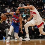 
              Washington Wizards guard Spencer Dinwiddie (26) is defended by Toronto Raptors forward Yuta Watanabe, of Japan, during the first half of an NBA basketball game, Friday, Jan. 21, 2022, in Washington. (AP Photo/Evan Vucci)
            