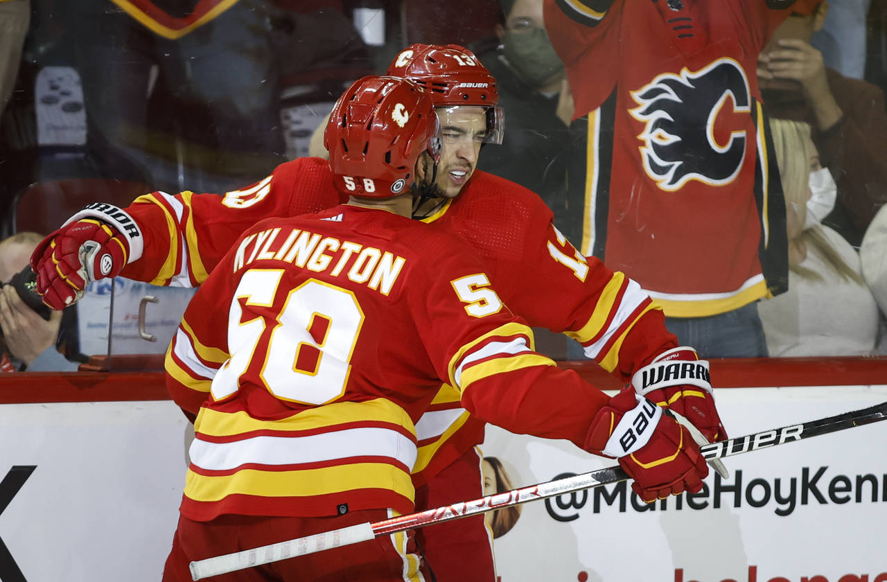 Calgary Flames' Johnny Gaudreau, right, celebrates his goal with teammate Oliver Kylington during o...