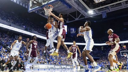 Kentucky guard Sahvir Wheeler (2) passes the ball off while being guarded by Mississippi State guar...