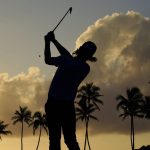 
              Andrew Putnam plays his shot from the 11th tee during the first round of the Sony Open golf tournament, Thursday, Jan. 13, 2022, at Waialae Country Club in Honolulu. (AP Photo/Matt York)
            
