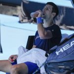 
              Defending men's champion Serbia's Novak Djokovic takes a drink during a practice practice session on Rod Laver Arena ahead of the Australian Open tennis championship in Melbourne, Australia, Wednesday, Jan. 12, 2022. AP Photo/Mark Baker)
            