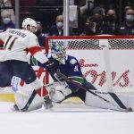 
              Vancouver Canucks goalie Spencer Martin, right, stops Florida Panthers' Jonathan Huberdeau during the shootout in an NHL hockey game Friday, Jan. 21, 2022, in Vancouver, British Columbia. (Darryl Dyck/The Canadian Press via AP)
            