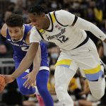 
              Marquette's Olivier-Maxence Prosper (12) steals the ball from Seton Hall's Tray Jackson during the first half of an NCAA college basketball game, Saturday, Jan. 15, 2022, in Milwaukee. (AP Photo/Aaron Gash)
            