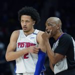 
              Detroit Pistons guard Cade Cunningham (2) talks with referee Leon Wood during the first half of an NBA basketball game against the Denver Nuggets, Tuesday, Jan. 25, 2022, in Detroit. (AP Photo/Carlos Osorio)
            